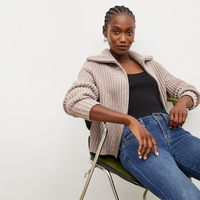 Front image of a woman wearing the william sweater in barley