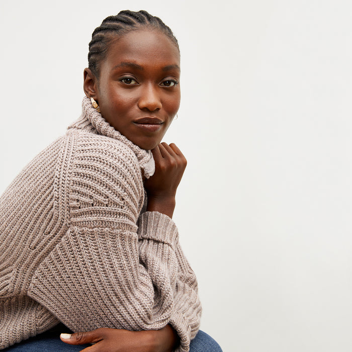 Front image of a woman wearing the william sweater in barley