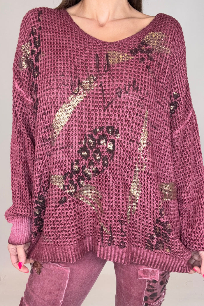 Wine red waffle knit top with leopard print, handwritten script details, and metallic gold brushstroke accents.