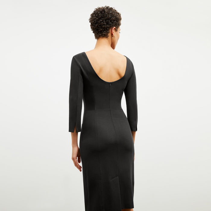 Back image of a woman wearing the winston dress in black