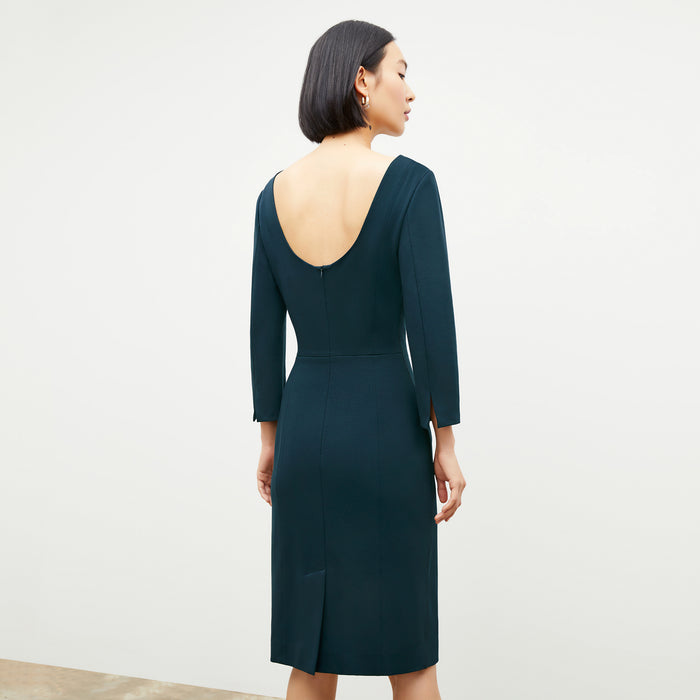 Back image of a woman wearing the Winston Dress in Deep Sea