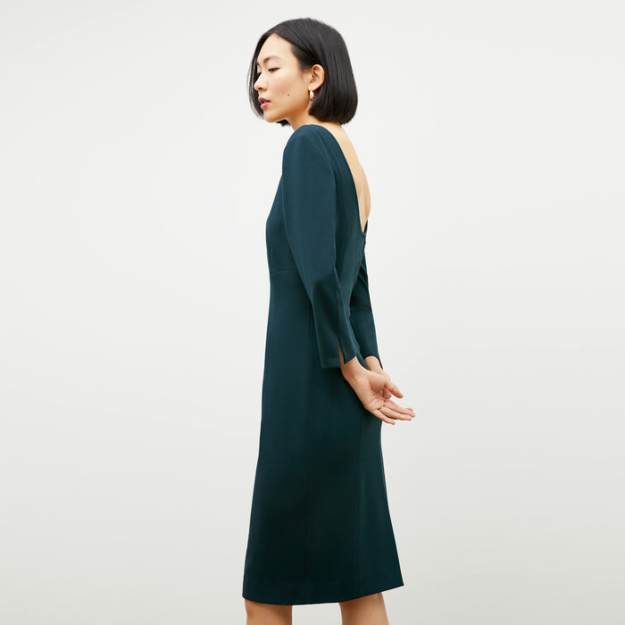 Side image of a woman wearing the Winston Dress in Deep Sea