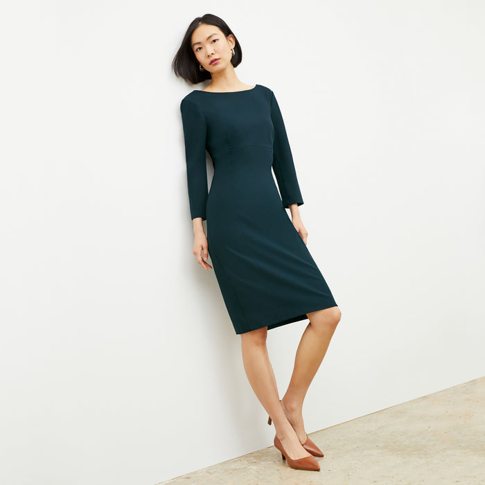 Front image of a woman wearing the Winston Dress in Deep Sea
