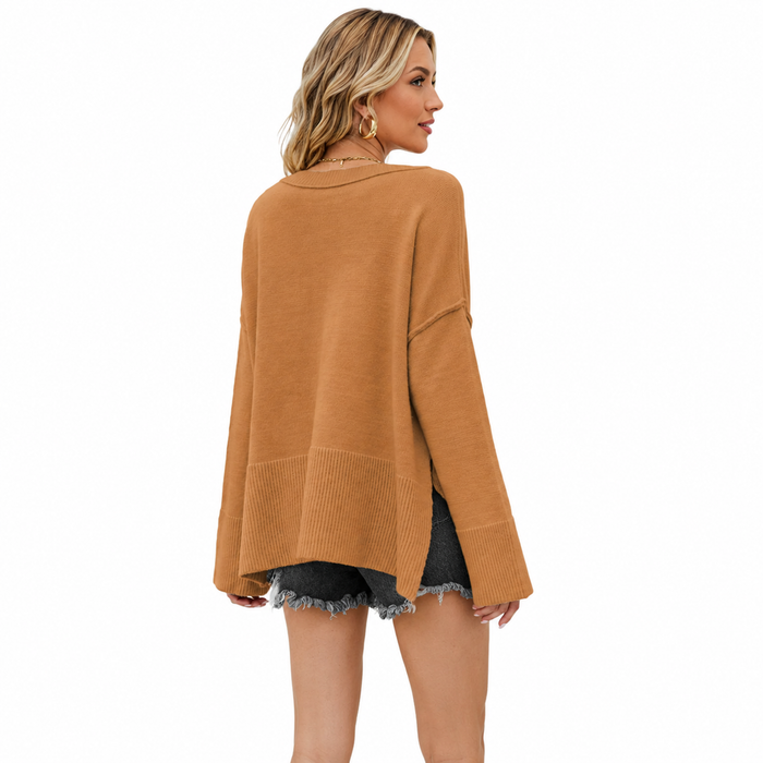 Women's camel dropped shoulder sweater shown from the back with ribbed hem, side slit and relaxed drape on a clean white background