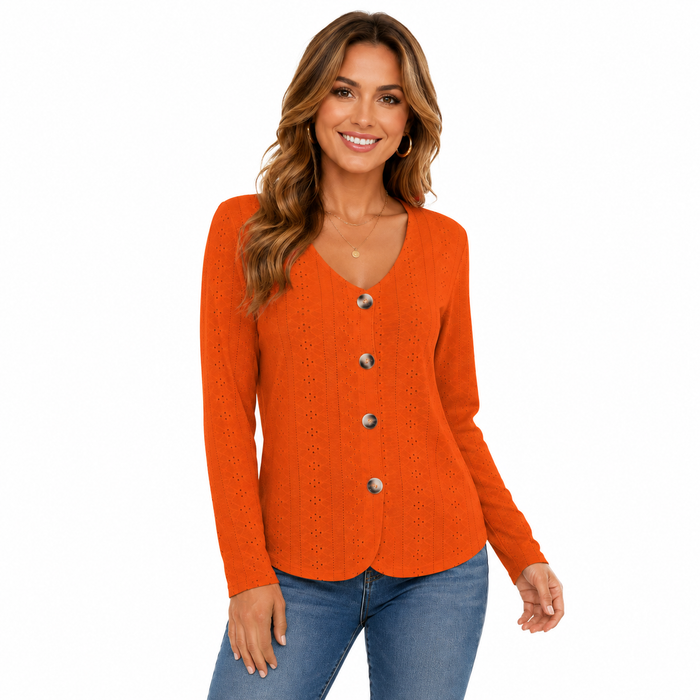 Women's orange long sleeve V neck blouse with button front and eyelet texture on model in three-quarter studio view.