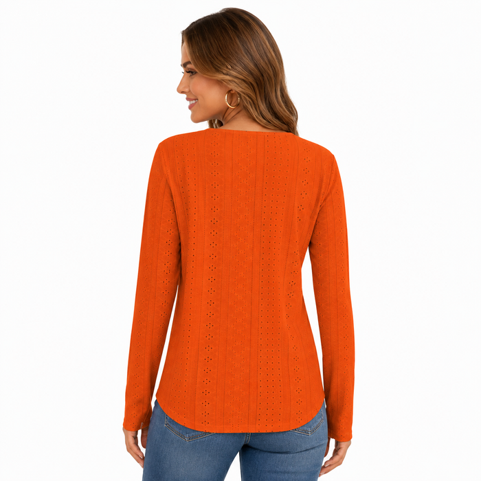 Women's orange long sleeve blouse shown from the back with curved hem and vertical eyelet texture on white background.