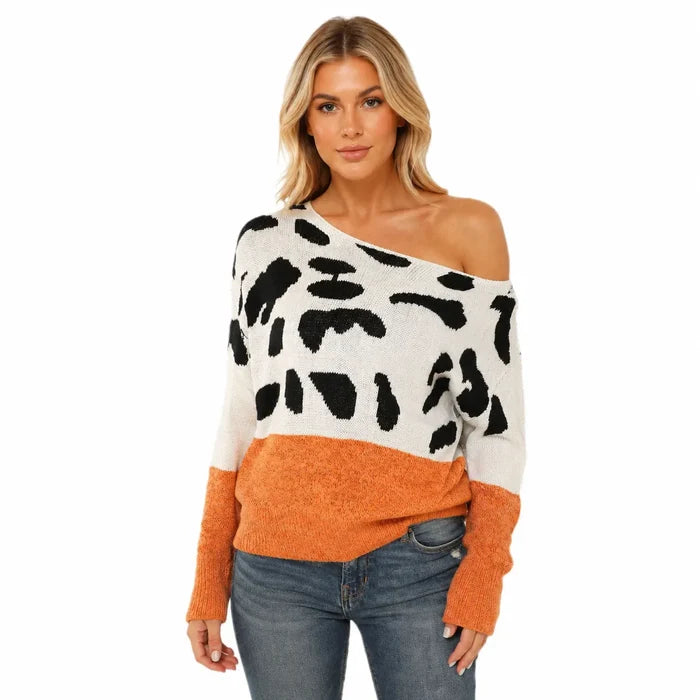 Women's orange one shoulder leopard print acrylic sweater on a professional female model against a clean white background.