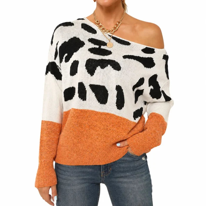 Women's orange one shoulder leopard print sweater in a front studio view showing the neckline, pattern, sleeves and hem.