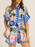 Women's shirt and shorts set with a printed button-down shirt and matching shorts, with pocket detail, for product reference.