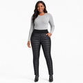 Women's quilted pants in black front view showing high waist styling, quilted panels, side sections and tapered trouser legs.