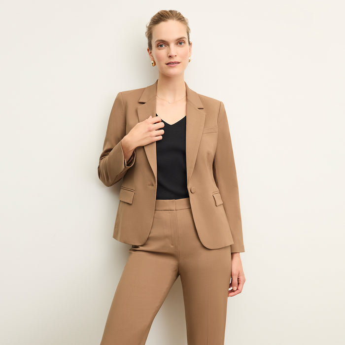 front image of a woman wearing the yasmine blazer in camel | Lead