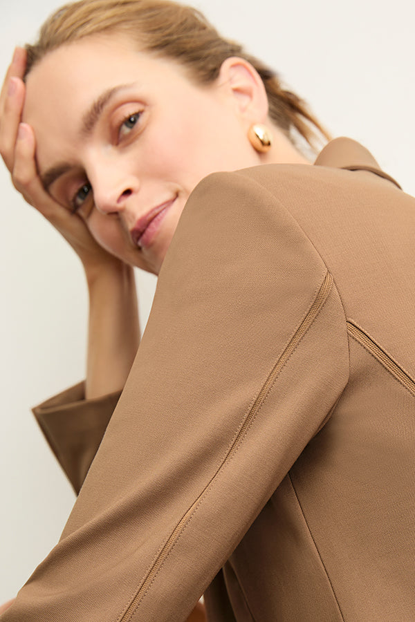 front image of a woman wearing the yasmine blazer in camel | Exclude | Grid Hover