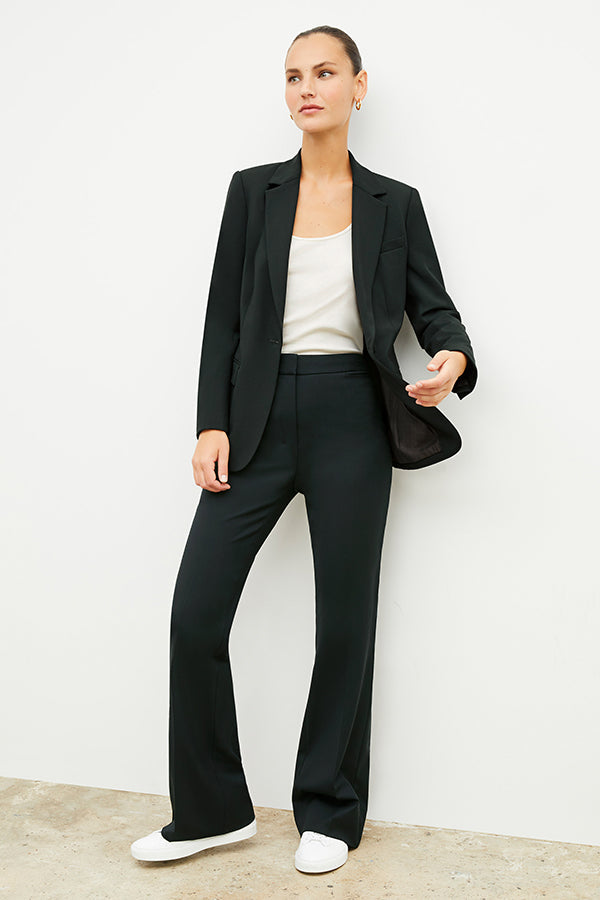 Front image of a woman wearing the yiyan blazer in forest | Exclude | Grid Hover