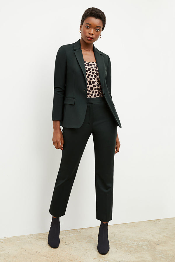 Front image of a woman wearing the yiyan blazer in forest | Exclude
