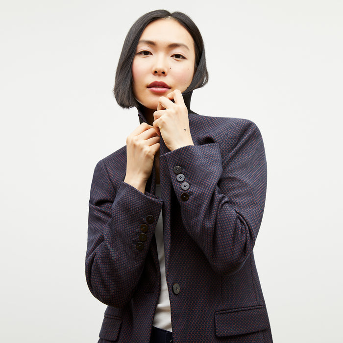 Front image of a woman wearing the yiyan blazer in navy multi