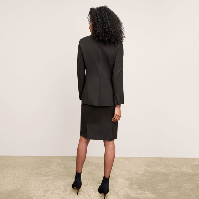 Back image of a woman standing wearing the Yiyan Blazer in Black