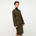 front image of a woman wearing the yuwei jardigan in dark elm | Lead