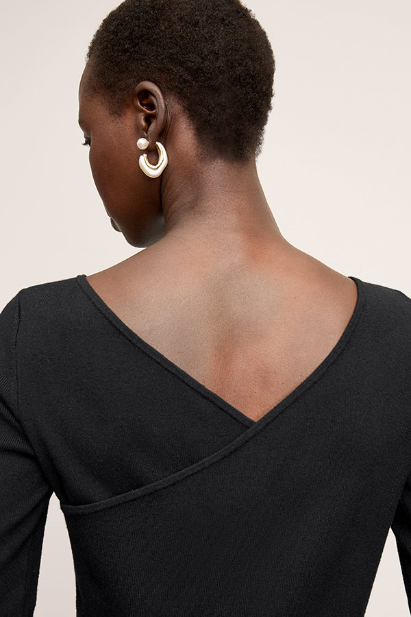 Back image of a woman wearing the Zana Dress in Black | Exclude