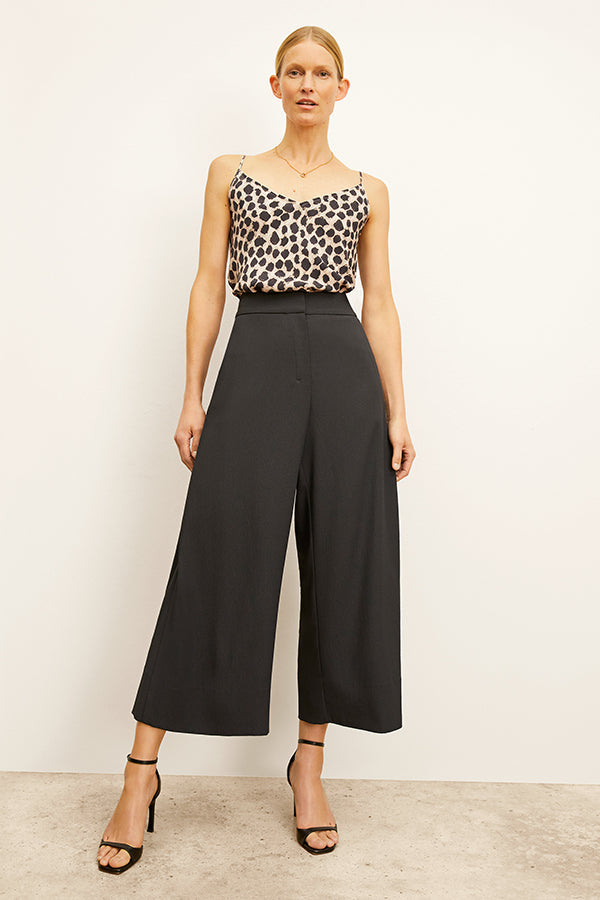 Front image of a woman wearing the Zhou Culotte - Eco Heavy Soft Wave :: Black | Grid Hover | Exclude