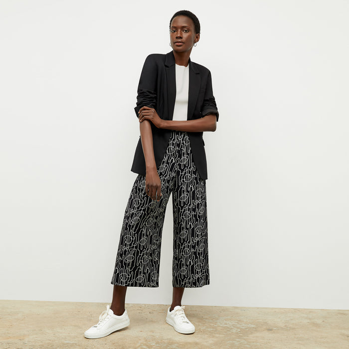 front image of a woman wearing the zhou culotte in symphony print