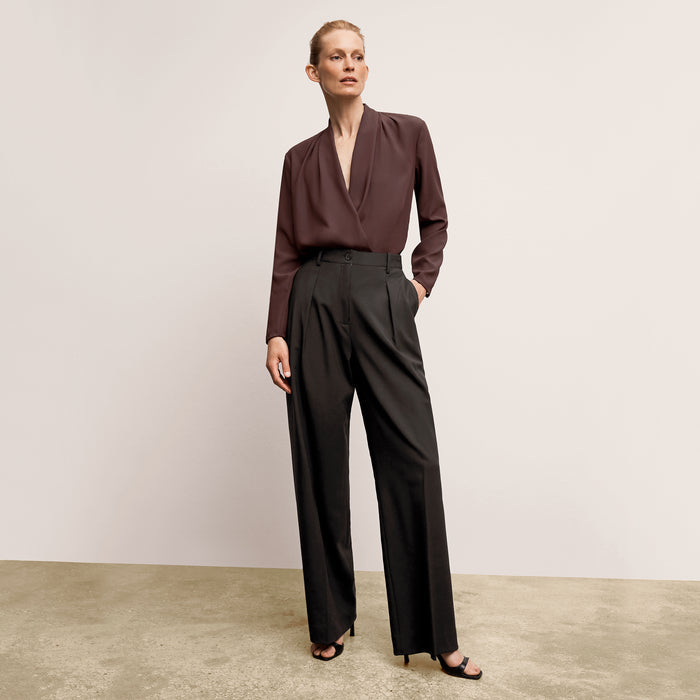 front image of a woman wearing the zuri pant in black | Lead