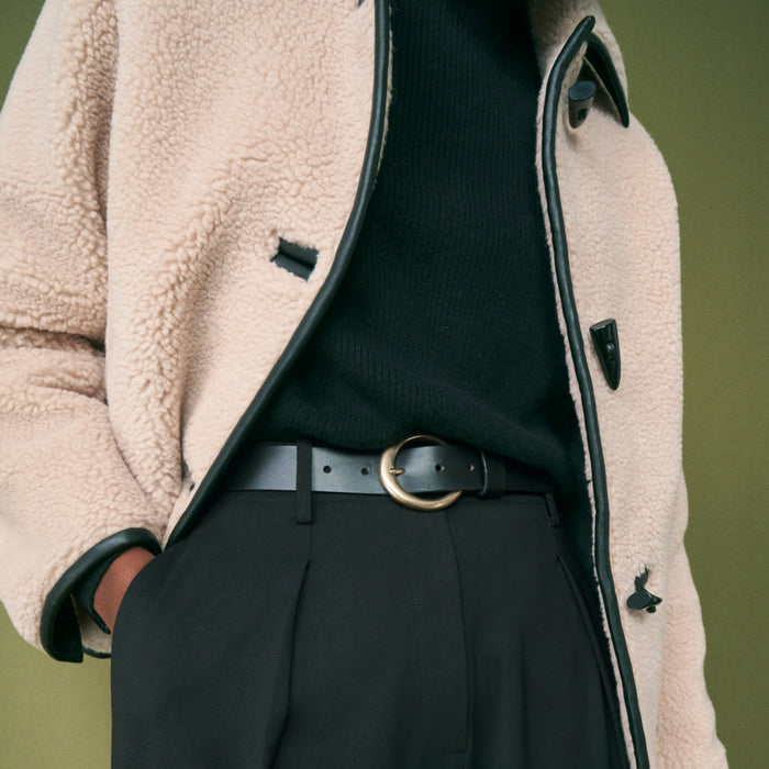 detail image of a woman wearing the zuri pant in black