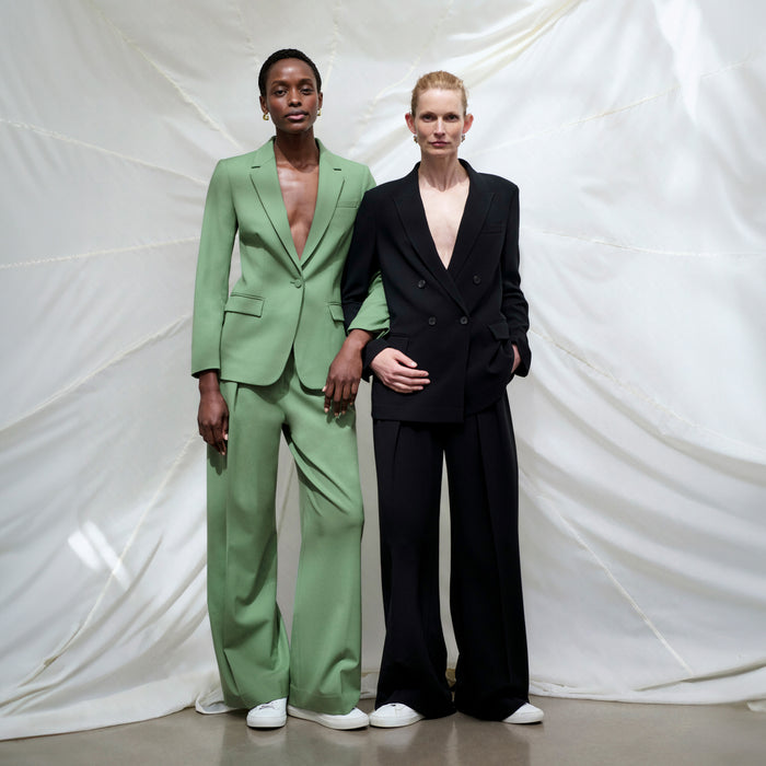 front image of a woman wearing the zuri pants in parisian green